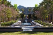 Rectangular fountain lined by trees on each side at the Grand Central Creative Campus